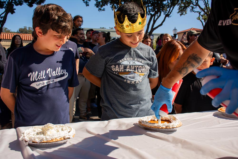 pie eating contestants eagerly awaiting the start