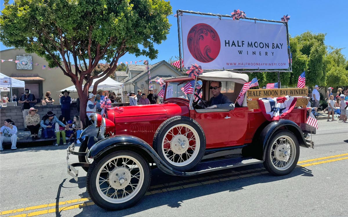 Half Moon Bay Winery vintage truck and banner at the annual Half Moon Bay Art & Pumpkin Festival parade
